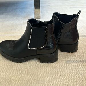 Snakeskin, bejeweled black ankle boots